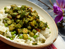 Plate of vegetarian food with okra, peas and rice