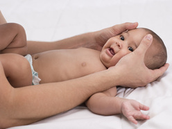 Happy baby getting a massage