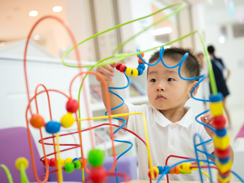 boy playing with a puzzle game