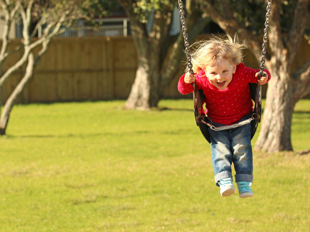 girl swinging outside