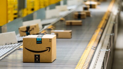 Amazon delivery boxes roll down a conveyor belt at Amazon's warehouse in Baltimore, Maryland.