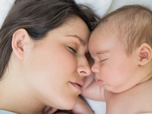 Baby and mum asleep together