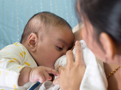 mother breastfeeding a child