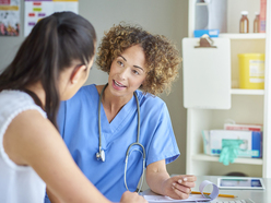 Woman talking to doctor