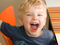 Little boy shouting into camera