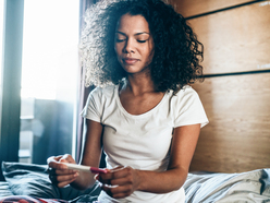 Woman looking at pregnancy test