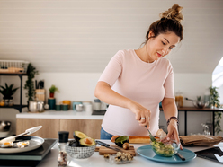 Woman mashing avocado