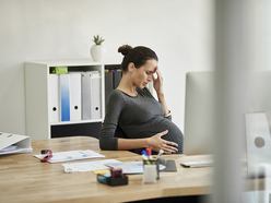 Pregnant woman feeling ill at work