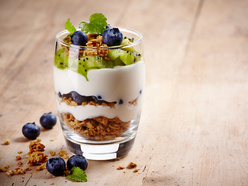 Greek yogurt and granola with kiwi fruit and berries