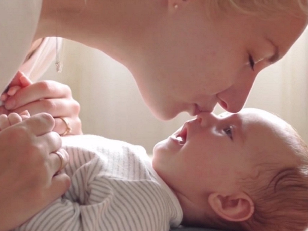 mom kissing baby's face