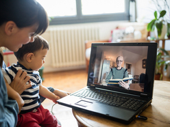 Mom and  baby video chatting with a grand mother