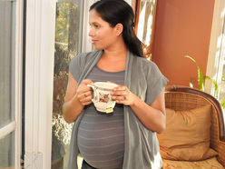 Pregnant woman drinking tea