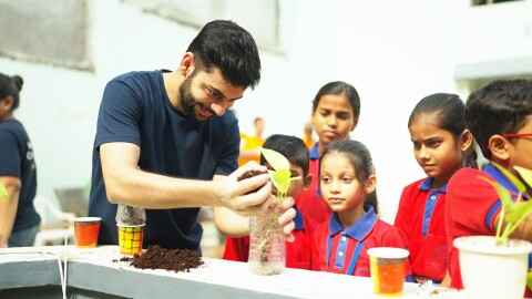 Amazonian planting a plant, as a part of save trees save lives campaign during Global Month of Volunteering