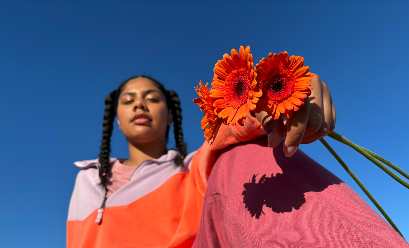 Portrait photo of a woman holding flowers