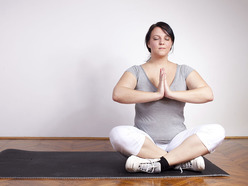 A woman meditating in a yoga pose