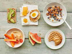 healthy snack options - avocado on cracker, eggs, yogurt, hummus and waffle with peanut butter