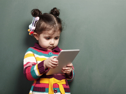 Child playing on a tablet