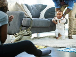 Baby taking his first steps