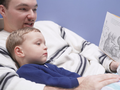 Dad reading to child