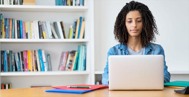 African American woman working on a laptop