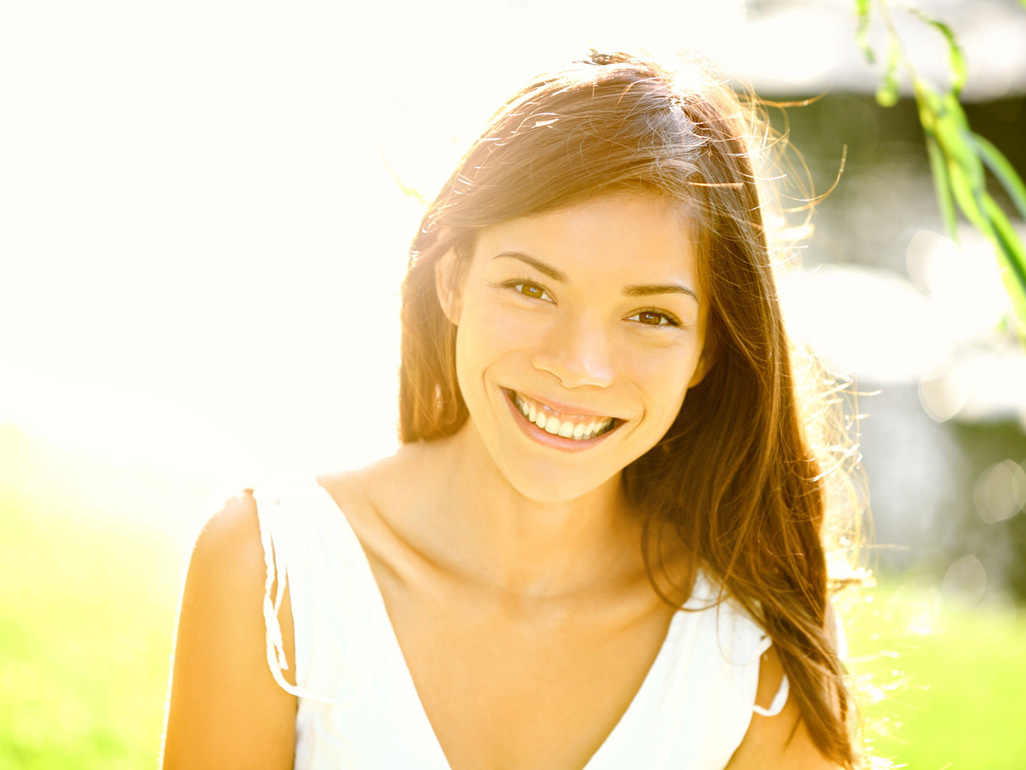 Young woman smiling in the sunshine