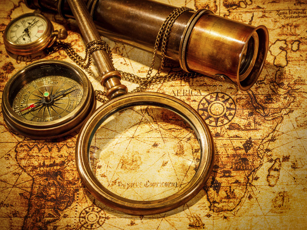 Old map with compass, magnifying glass and telescope