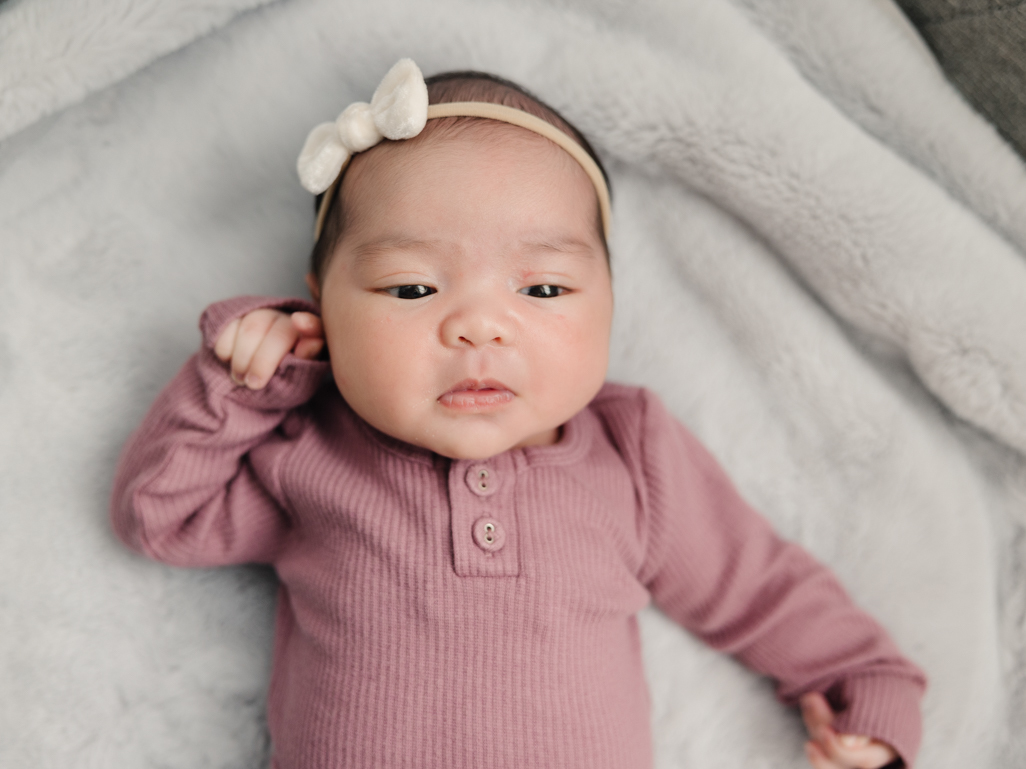 Newborn baby with bow