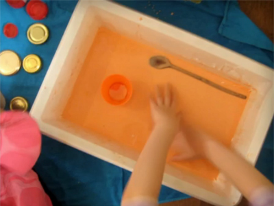 Toddler playing with gloop