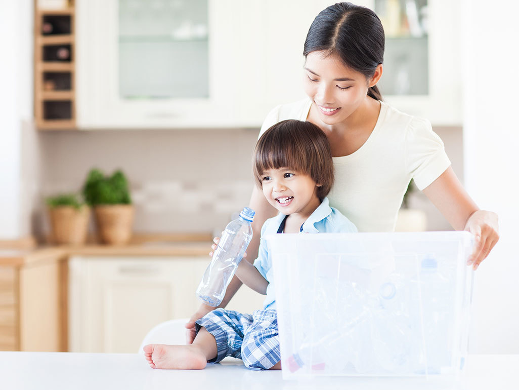 Mum and child with plastic bottle