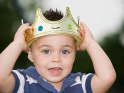 Toddler boy wearing a crown