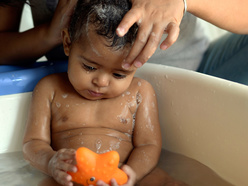 A baby in a baby bath