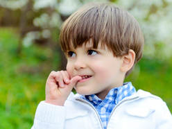 Boy biting his nails