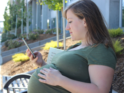 pregnant woman sitting on bench