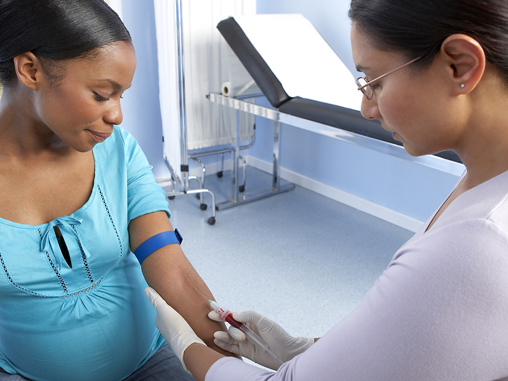 Pregnant woman having blood drawn