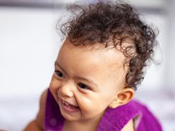 One year old girl smiling