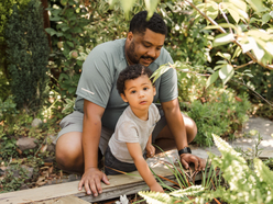 Dad and son exploring nature 