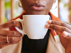 woman holding a tea cup