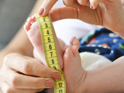 preemie being measured