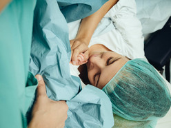 mom meeting her baby right after a C-section