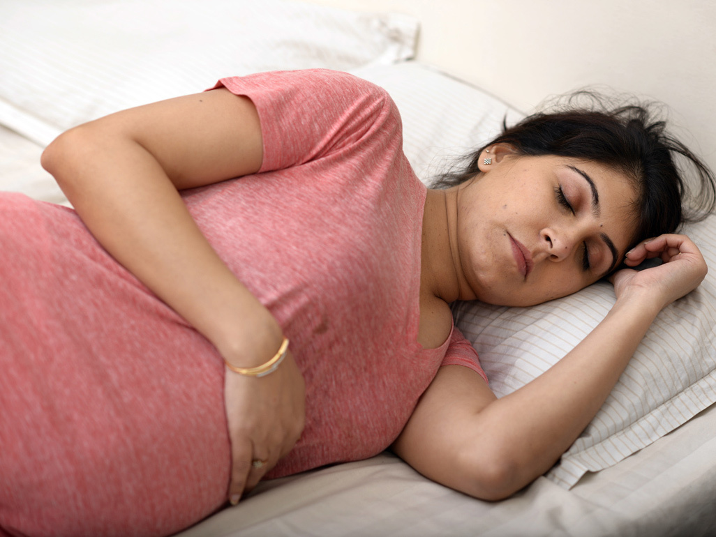 Woman asleep in bed