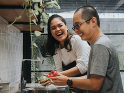 couple prepping vegetables in the kitchen