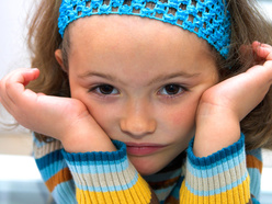 Grumpy preschool girl resisting discipline